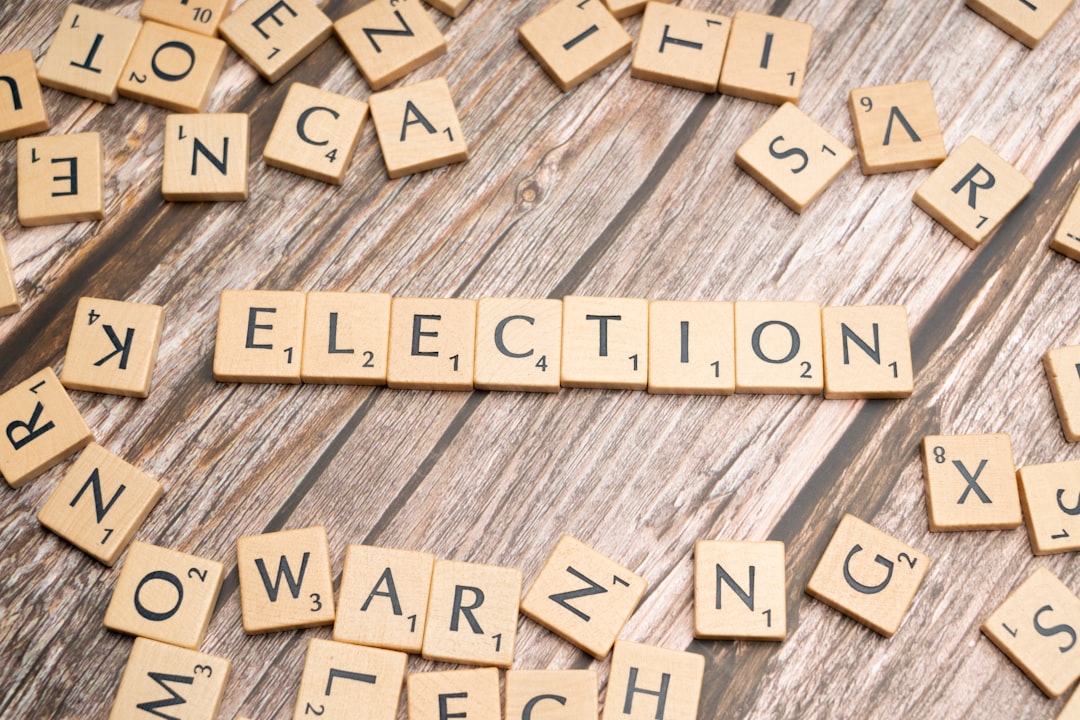 scrabble letters spelling election on a wooden table