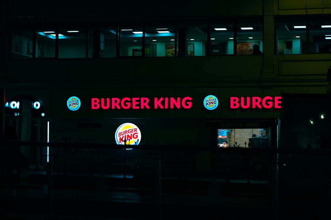a burger king restaurant lit up at night