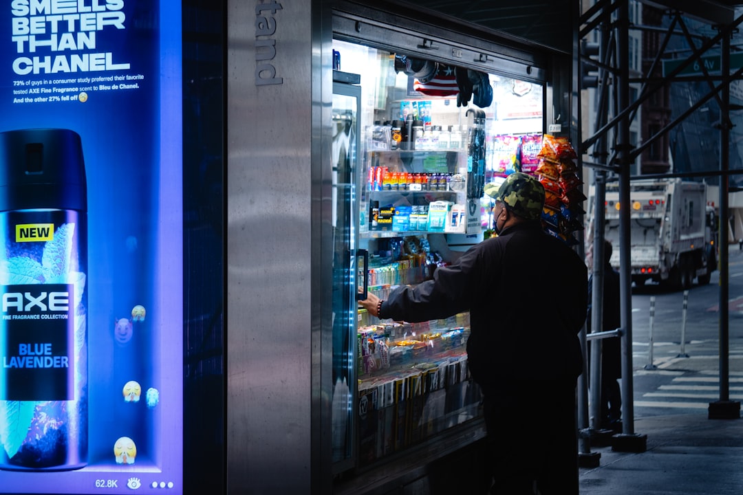 a man standing in front of a vending machine