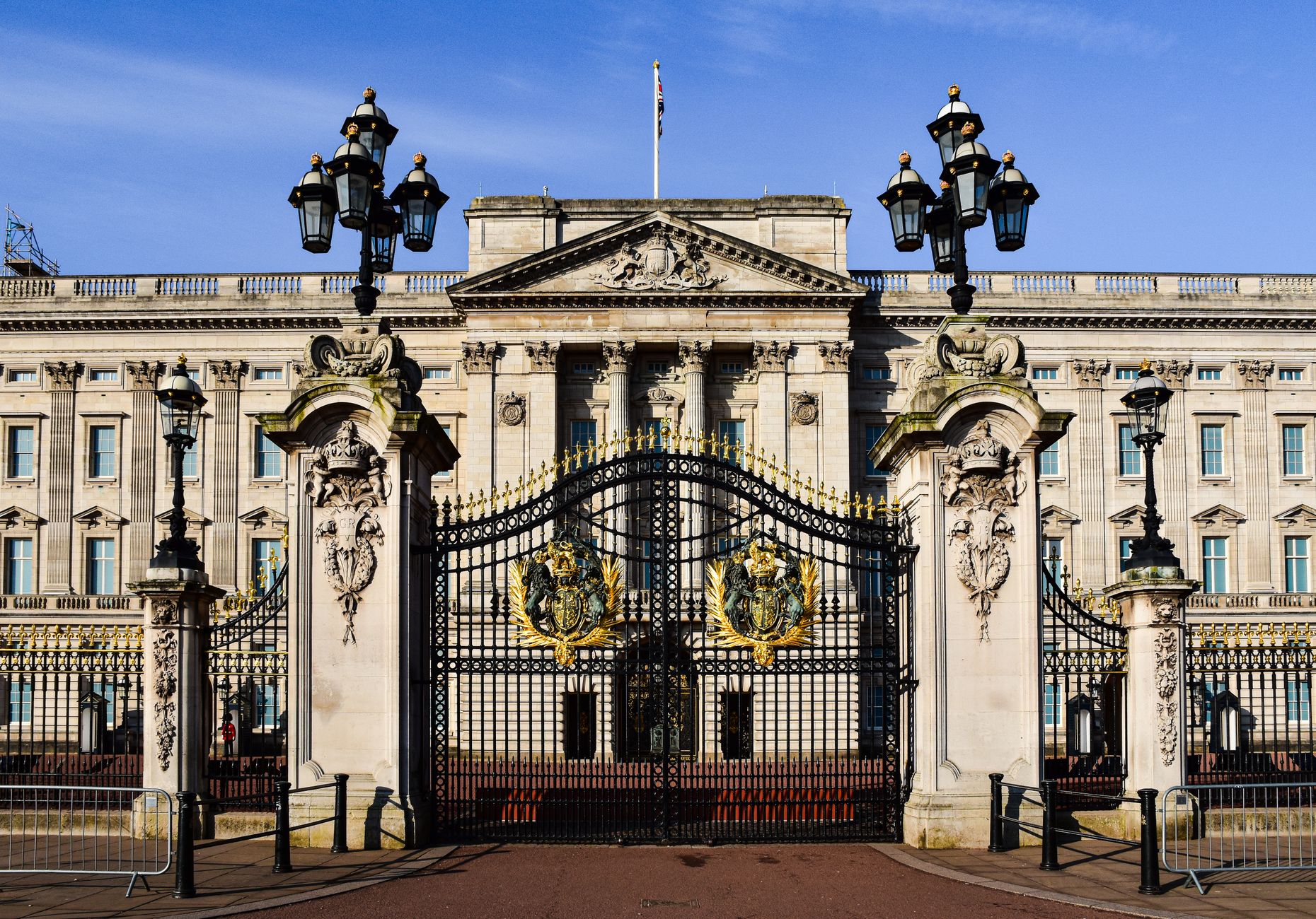 Front view of Buckingham Palace with iconic gates in London, England.