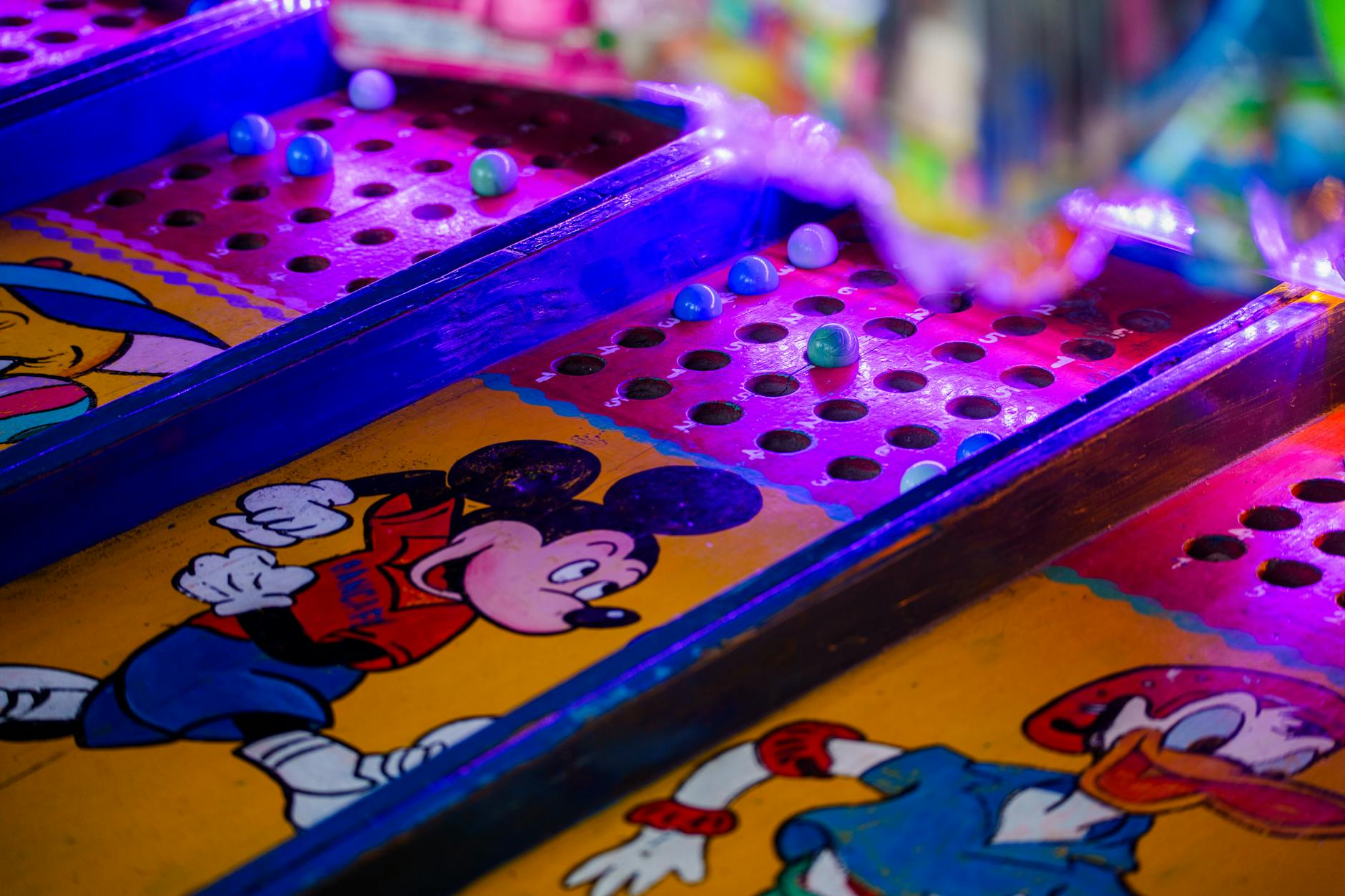 Vibrant arcade game featuring iconic cartoon characters under colorful lighting.