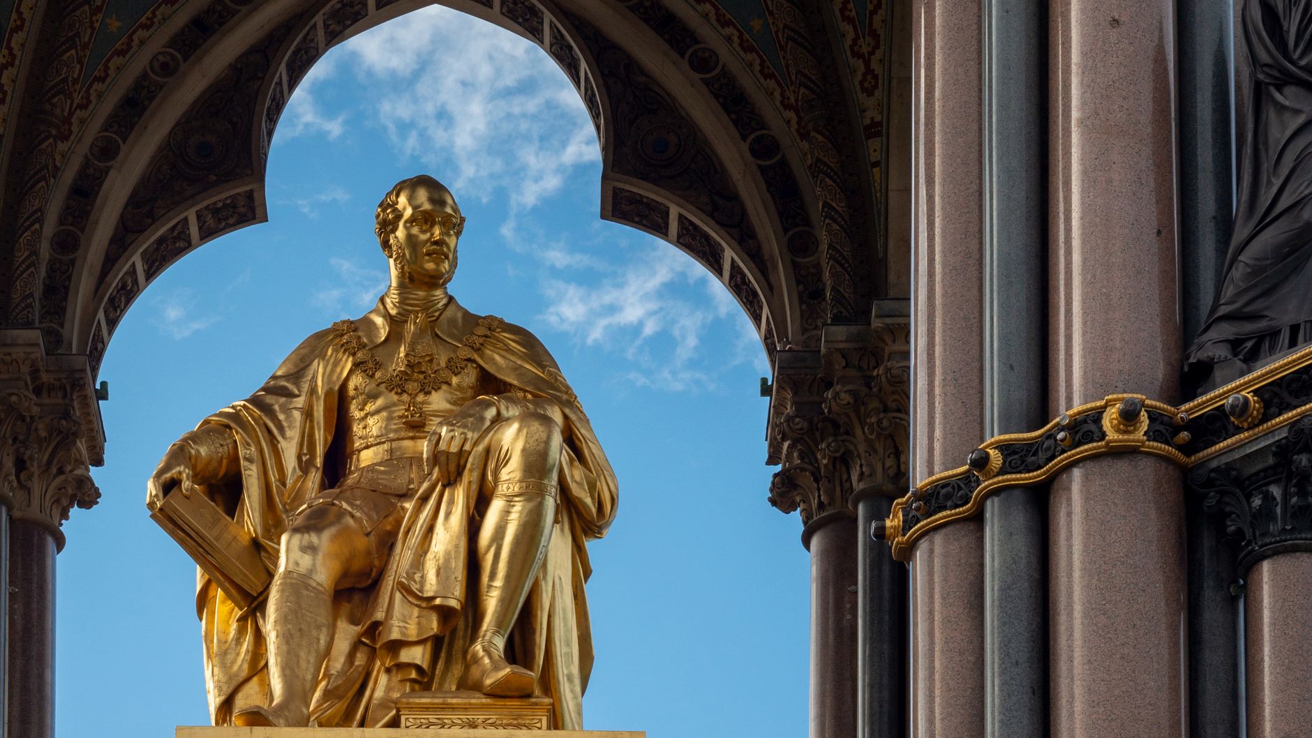 Close-up of the golden statue of Prince Albert at the Albert Memorial in Kensington Gardens, London.
