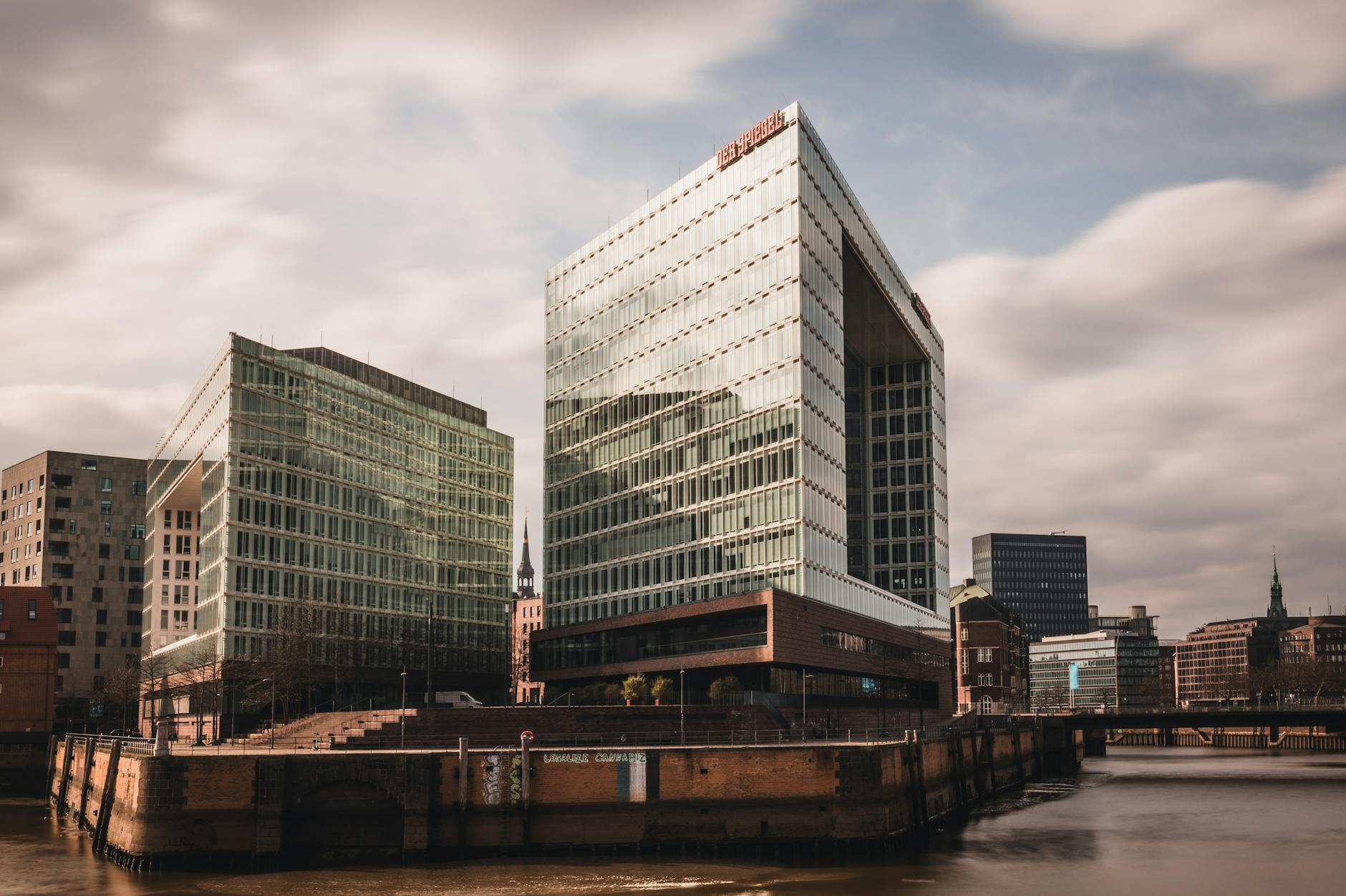 Contemporary architecture of Der Spiegel building in Hamburg captured during daytime with a waterfront view.