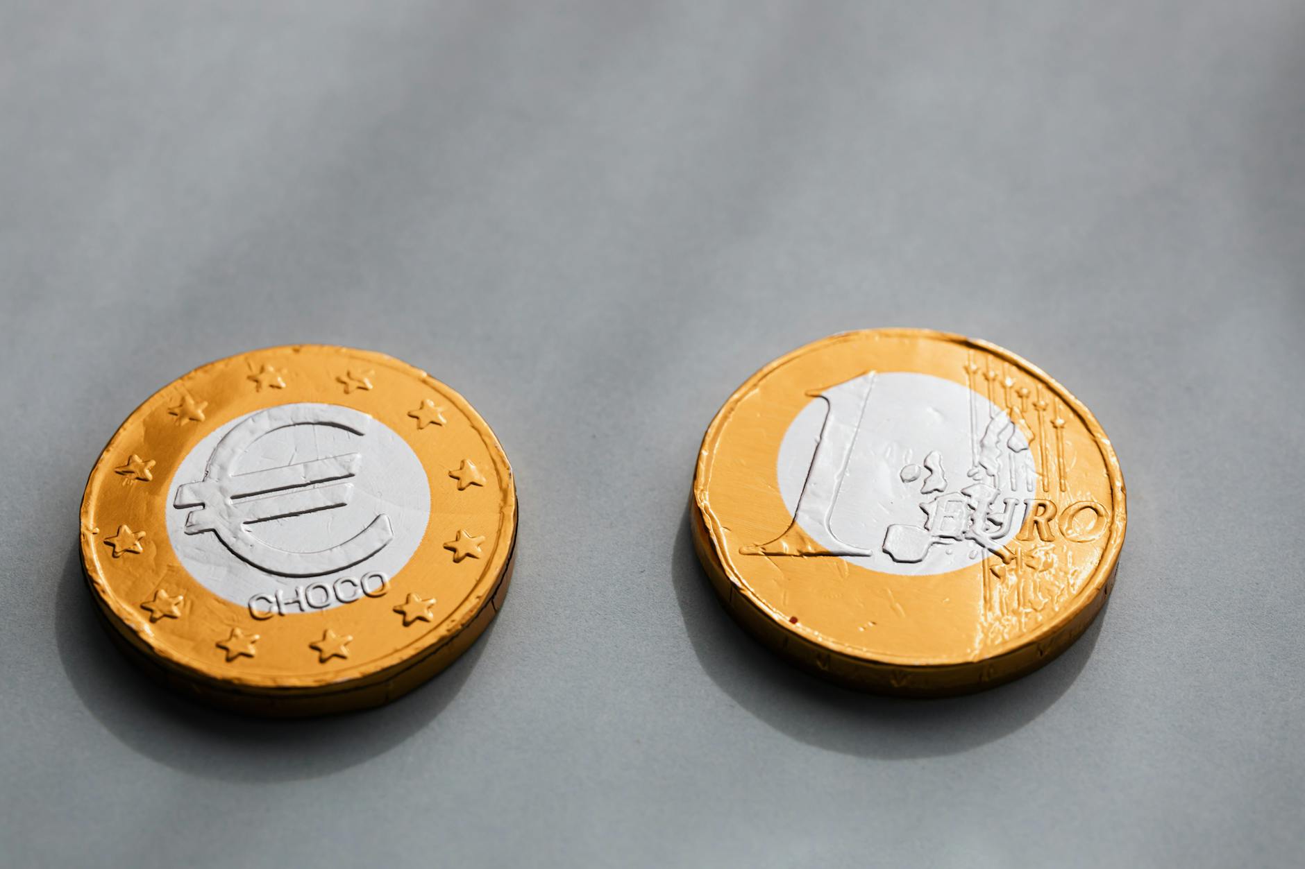 From above of coins denomination of one euros placed on gray surface